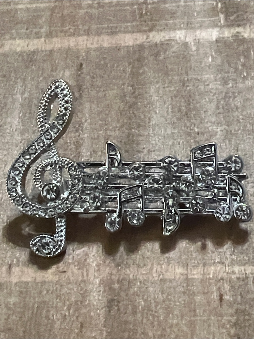 3/$18 Crystal Music Note Brooch - Lot 1000